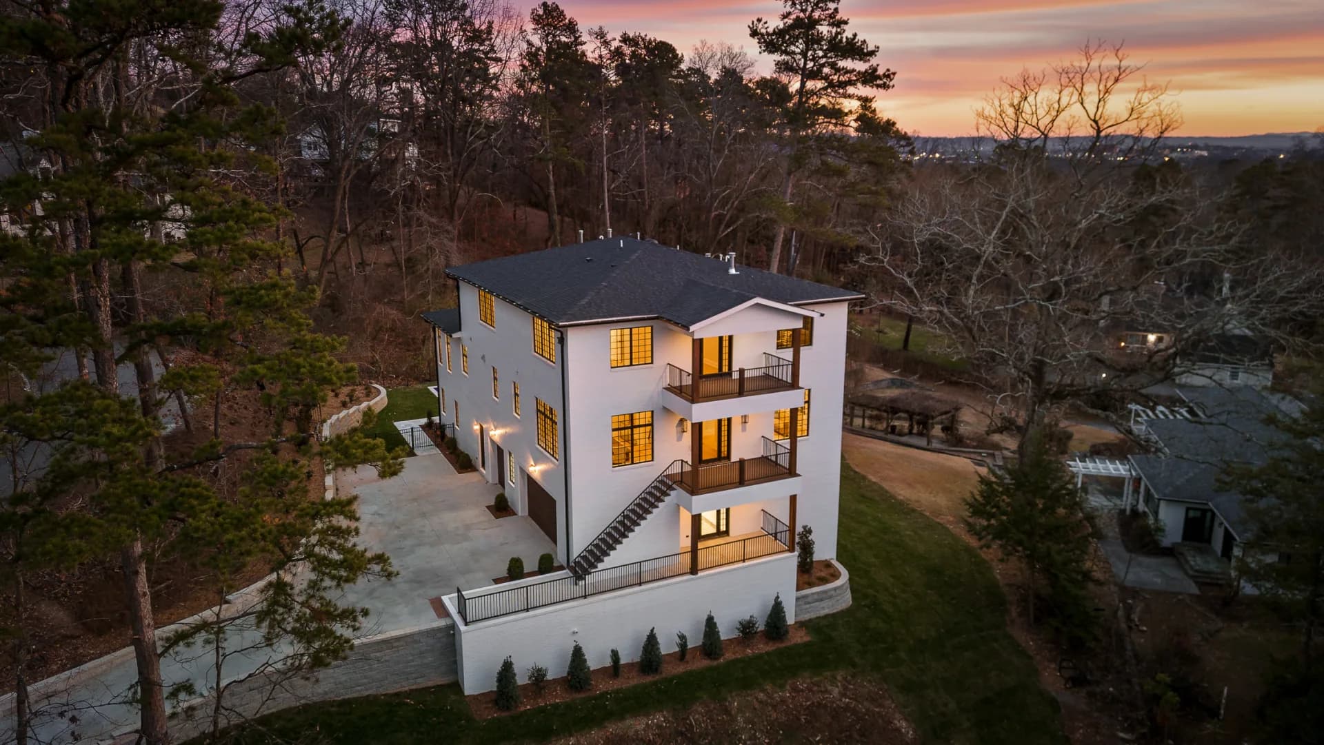 Modern custom home architecture with clean lines and natural stone