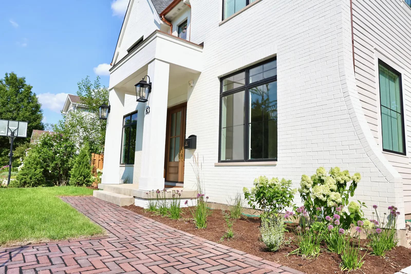 Brick walkway and white-brick side detail at 63 Waverly