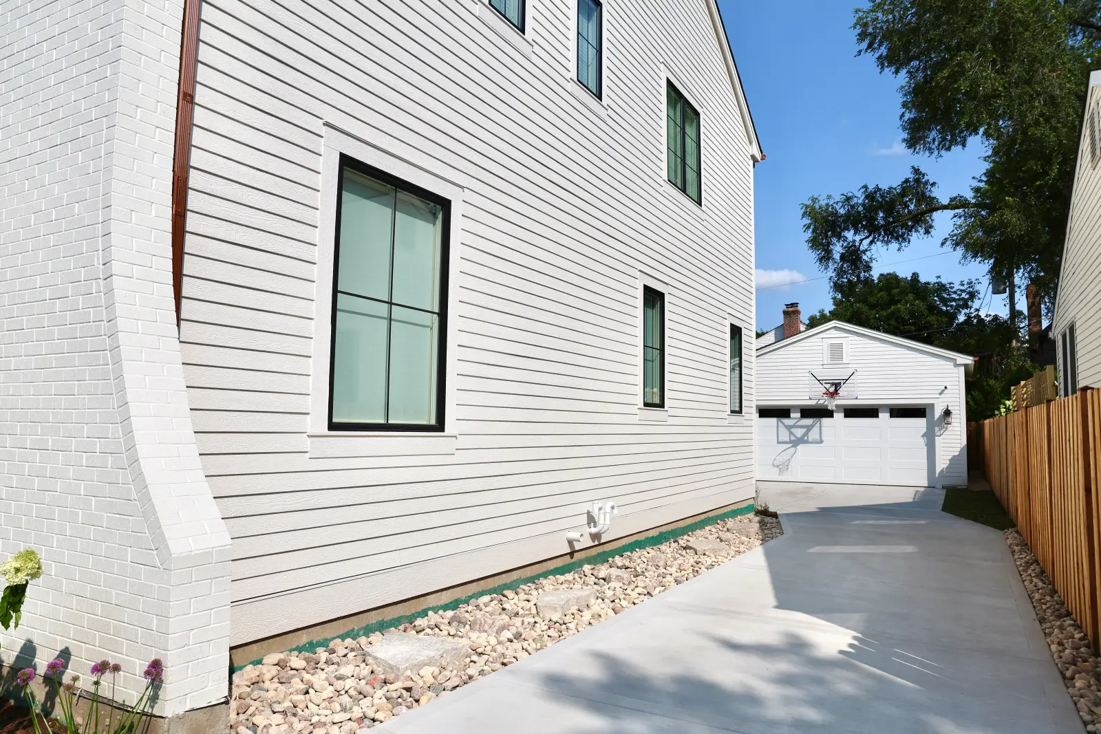 Side elevation and driveway of the completed 63 Waverly home